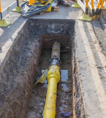 Underground pipe being fixed in trench — NRW Consulting in Burleigh Heads, QLD