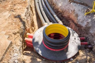 Cables and optical fibres in the digging on a construction site — Leak Detection in Burleigh Heads, QLD