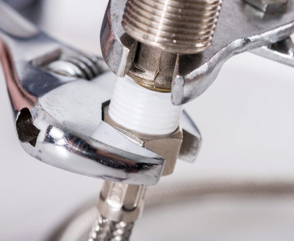 Plumber screwing plumbing fittings — Blog in Burleigh Heads, QLD