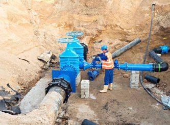 Worker in protective workwear underground — Water Management Near Me in TAS